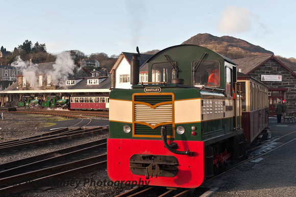 The Baguley diesel shunter pulls the train away from the station onto The Cob.