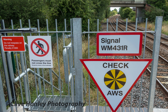 A mess of signs at the platform end.