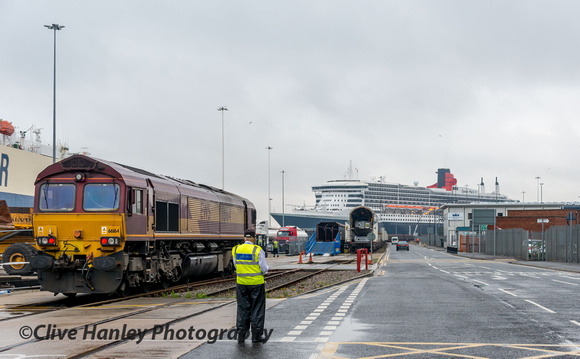 66164 was ticking over having arrived with its 1,200 tonne train of Jaguar cars from Castle Bromwich. Queen Mary 2 is moored on the Ocean Terminal.