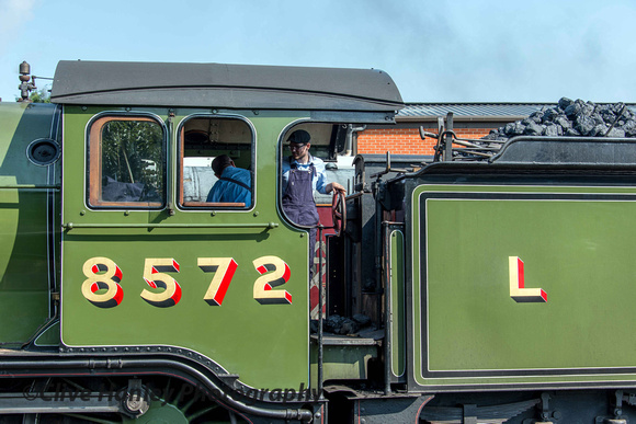 The fireman was receiving instruction from the driver on the footplate of the B12.
