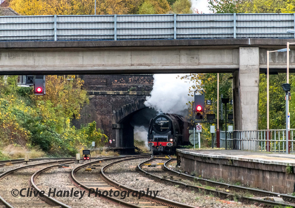 Stanier Princess Coronation Pacific no. (4)6233 Duchess of Sutherland appears from under the bridge.