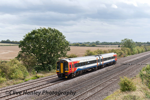 2-car unit no 158810 heads north on the slow line.
