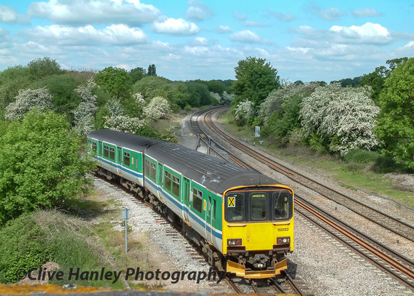A two car suburban commuter train swings off the branchline from Stratford upon Avon.