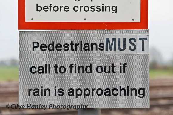 One of several safety signs at the foot crossing across the MML.