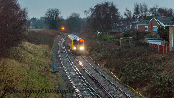 A northbound unit rounds the curve from Maghull towards the new station. Unit 508108