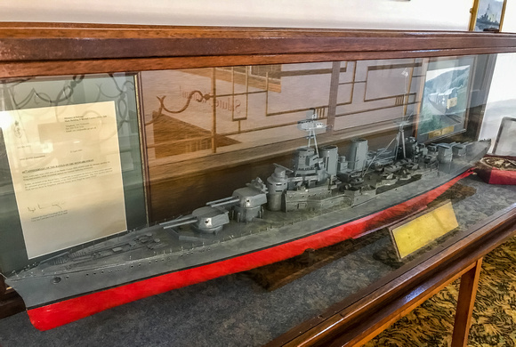 A scale model of HMS Hood, a Letter of tribute from the MOD and ....... at the far end....