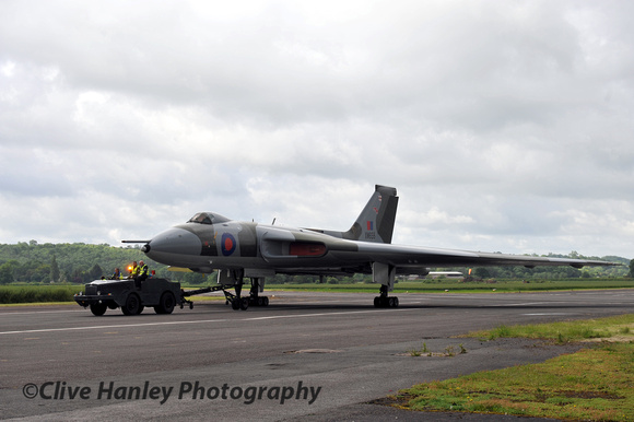 8.54am. XM655 is seen being towed across the main runway to its position on the market site.