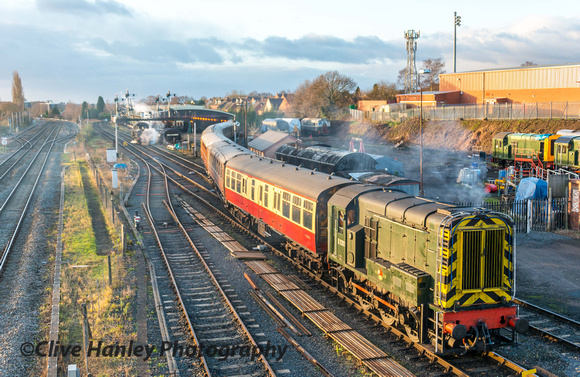 Class 08 shunter brings a rake of coaches out of the SVR carriage shed at Kidderminster