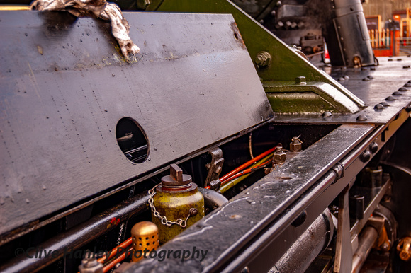 Hidden under the running plate