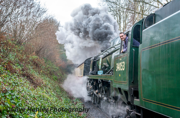 Driver Duncan Ballard takes the air as 34053 passes the water works at Trimpley.