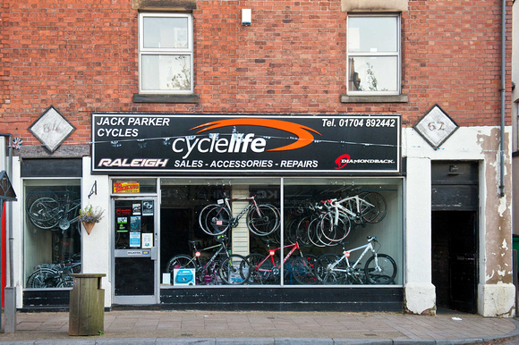 Jack Parker's bike shop on the main road. Kuota bikes in the window.
