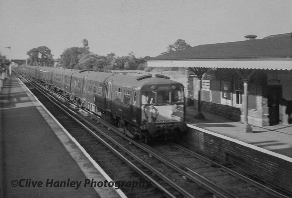 A 5 car Class 502 unit arrives at Maghull in 1964. It was in green livery which I believe suited them far better than the corporate BR blue that they were plastered with later.