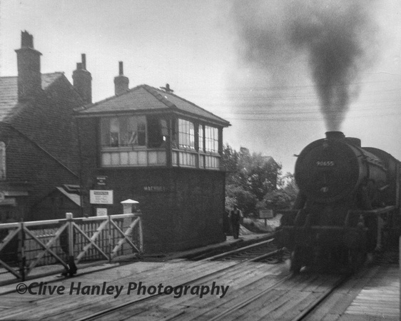 A rare photo of mine taken in 1964 (aged 11) of WD 2-8-0 no 90655 on the level crossing taking a northbound freight from the docks.
