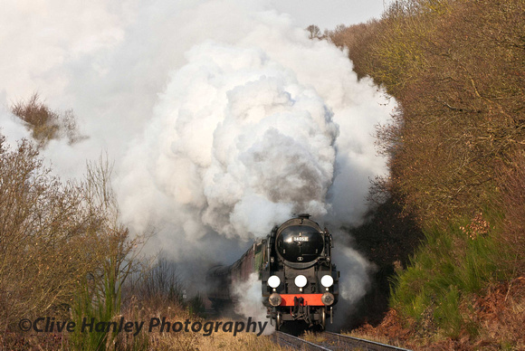 Bulleid Battle of Britain 4-6-2 Pacific no 34053 Sir Keith Park makes fine progress as it approaches.