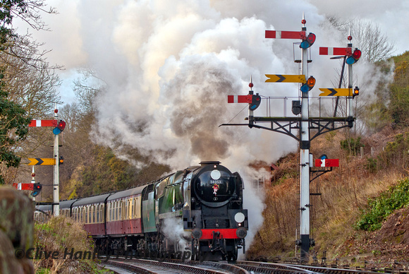 34053 Sir Keith Park departs Bewdley and passes the fine display of semaphore signals.