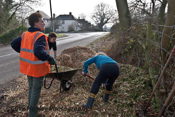 3 ladies were shifting a small mountain of wood chippings as a bed for the nature footpaths.