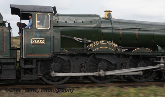 A panning shot of 7802 Bradley Manor as it drops back down towards Bewdley.