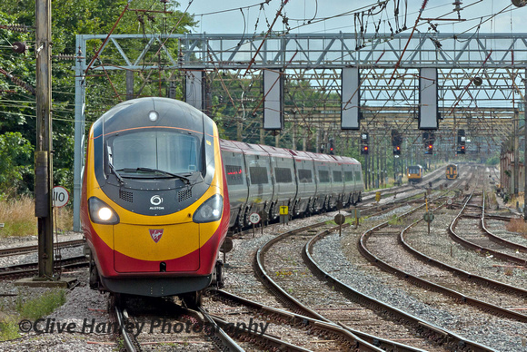 Pendolino service 1S69 from Euston to Glasgow Central arrives.