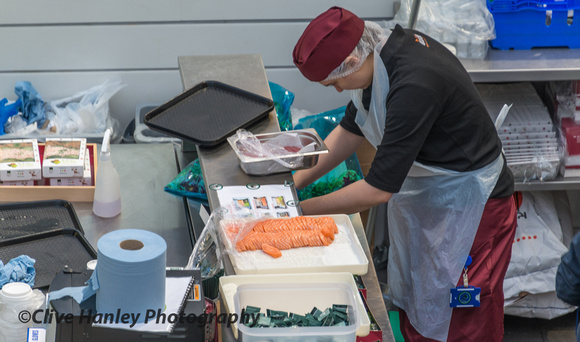Preparing the salmon sushi.