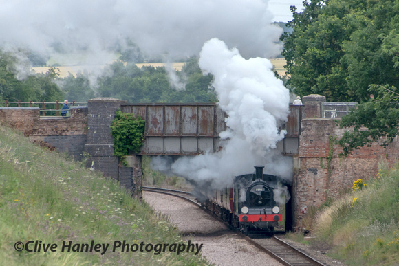 M7 no 30053 bursts from under the bridge at Danemoor Green with a train for Wymondham.