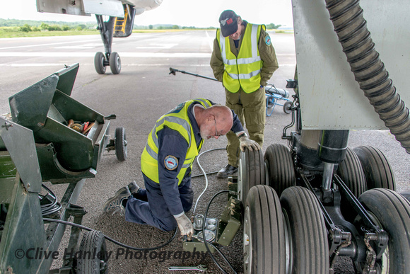 Eric can be seen checking tyre pressures. The nitrogen filled tyres must be at a pressure of 16.5BAR