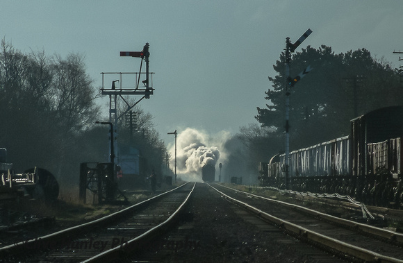 An atmospheric display as a train makes steady progress from the south.