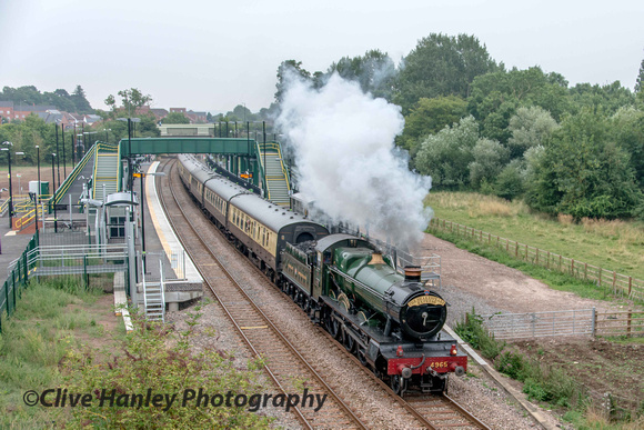GWR Hall Class 4-6-0 no 4965 Rood Ashton Hall climbs away from Stratford Parkway with the lunchtime service to Birmingham.