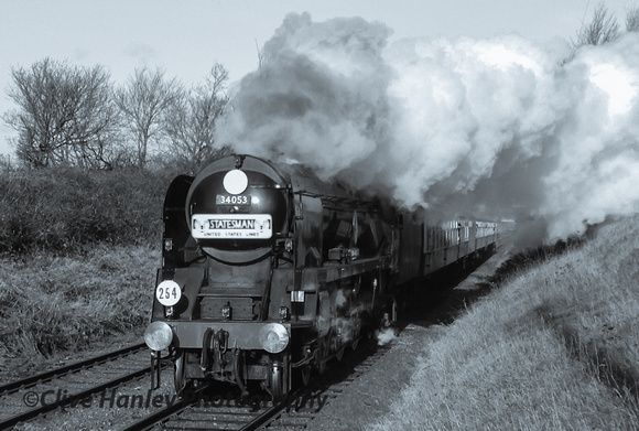 34053 Sir Keith Park passes carrying the "Statesman" headboard.
