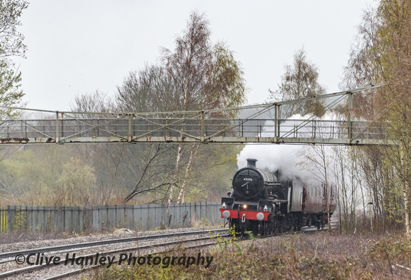 Jubilee Class 4-6-0 no 45596 Bahamas passes beneath the footbridge on the approach to Whitchurch.