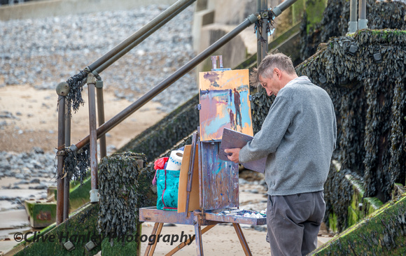 An artist was working next to one of the groynes