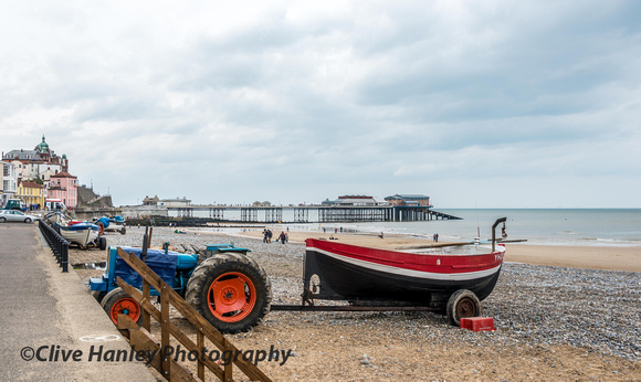 Old tractors are used to drag the fishing boats up and down the beach.