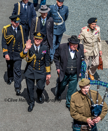 The VIP's arrive led by a Scottish Piper. King George VI, Sir Winston Churchill & General Montgomery.