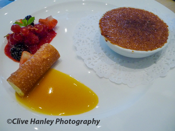 Caramel creme brulee with a white chocolate and passion fruit nougatine cigarette