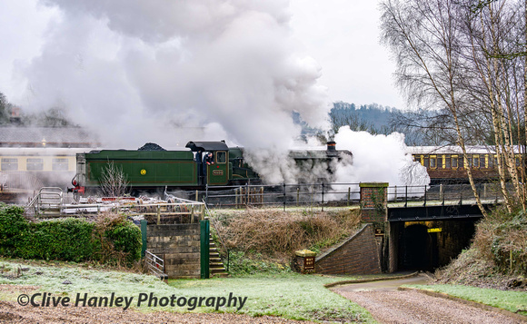 4930 moves off shed across the access bridge from the car park with cylinder drain cocks wide open.