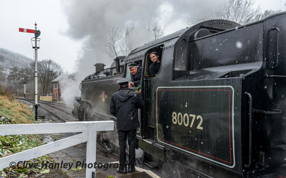 The train guard chats with the footplate crew while they await the signal. It was a long wait.