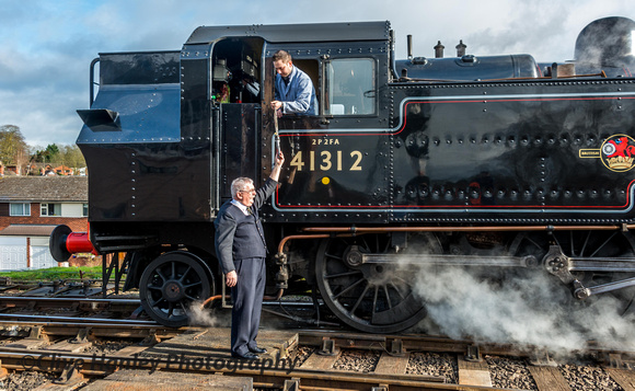 The bobby hands up the single line token to a crew member on 41312.