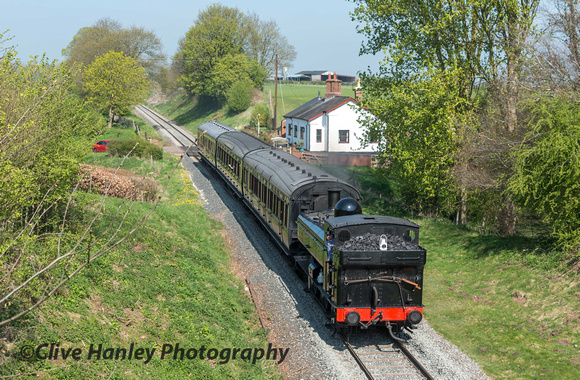 7714 heads south past the crossing keepers cottage with the 11.35am from Bridgnorth