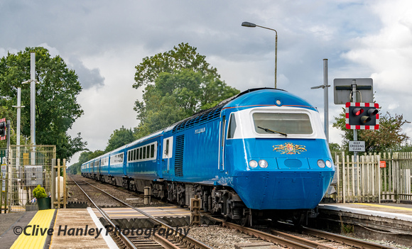 Led by M43059 the train accelerates through Prees