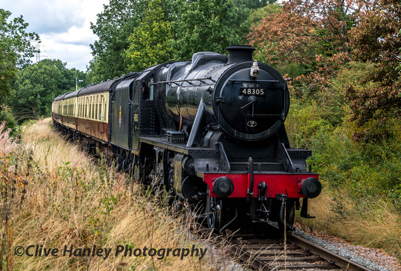The vegetation is almost onto the track as 48305 climbs away from Rothley past the golf course.
