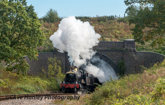 7820 Dinmore Manor bursts out of Greet tunnel carrying the Cheltenham Spa Express headboard.