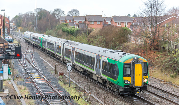 Unit 172212 in the old LM green livery moves wrong line towards the sidings.