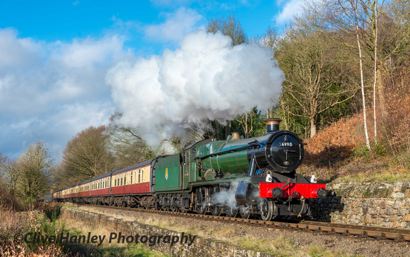 In glorious sunshine 6990 Witherslack Hall passes Tenbury Wall.