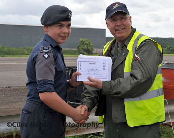 12.18pm. Chairman of the XM655 MaPS Charles Brimson presents ATC cadet ?? with a VIP Cockpit pass.