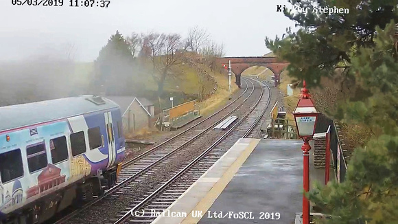 A service train has stopped at Kirkby Stephen station