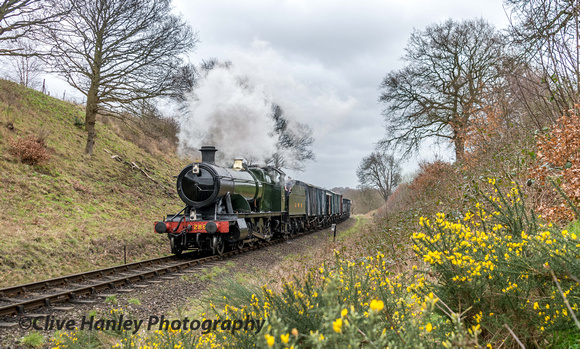 With the gorse in full flower 2857 passes through the cutting.