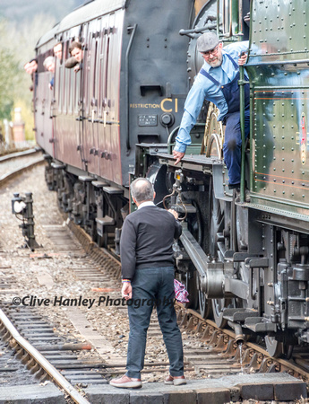The single line token is passed from the footplate of Bradley Manor as it arrives into platform 2 at Bewdley