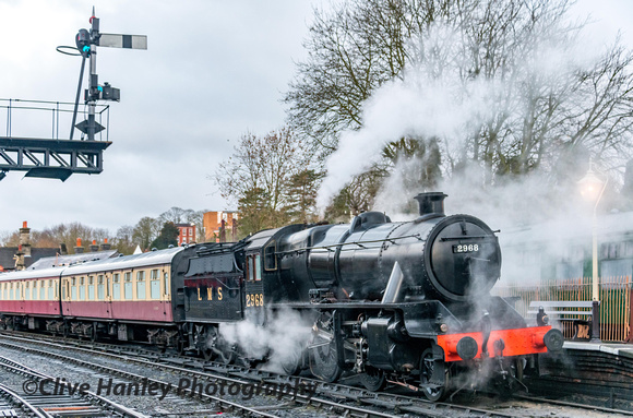 Newly outshopped in plain black livery Stanier mogul no (4)2968 awaits departure with the 9.10 to Kidderminster