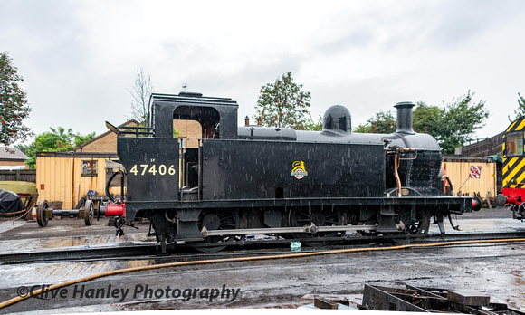 Jinty 0-6-0 no 47406 sits out in the rain.