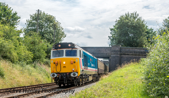 After a walk to Kinchley lane 50017 is seen rounding the curve having passed beneath the bridge.