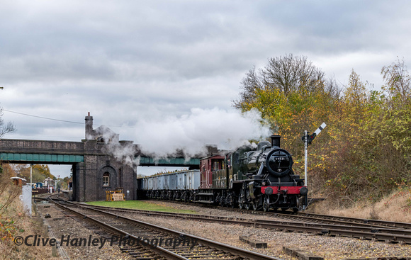 Ivatt mogul no 46521 passes through Quorn with the mineral wagons.